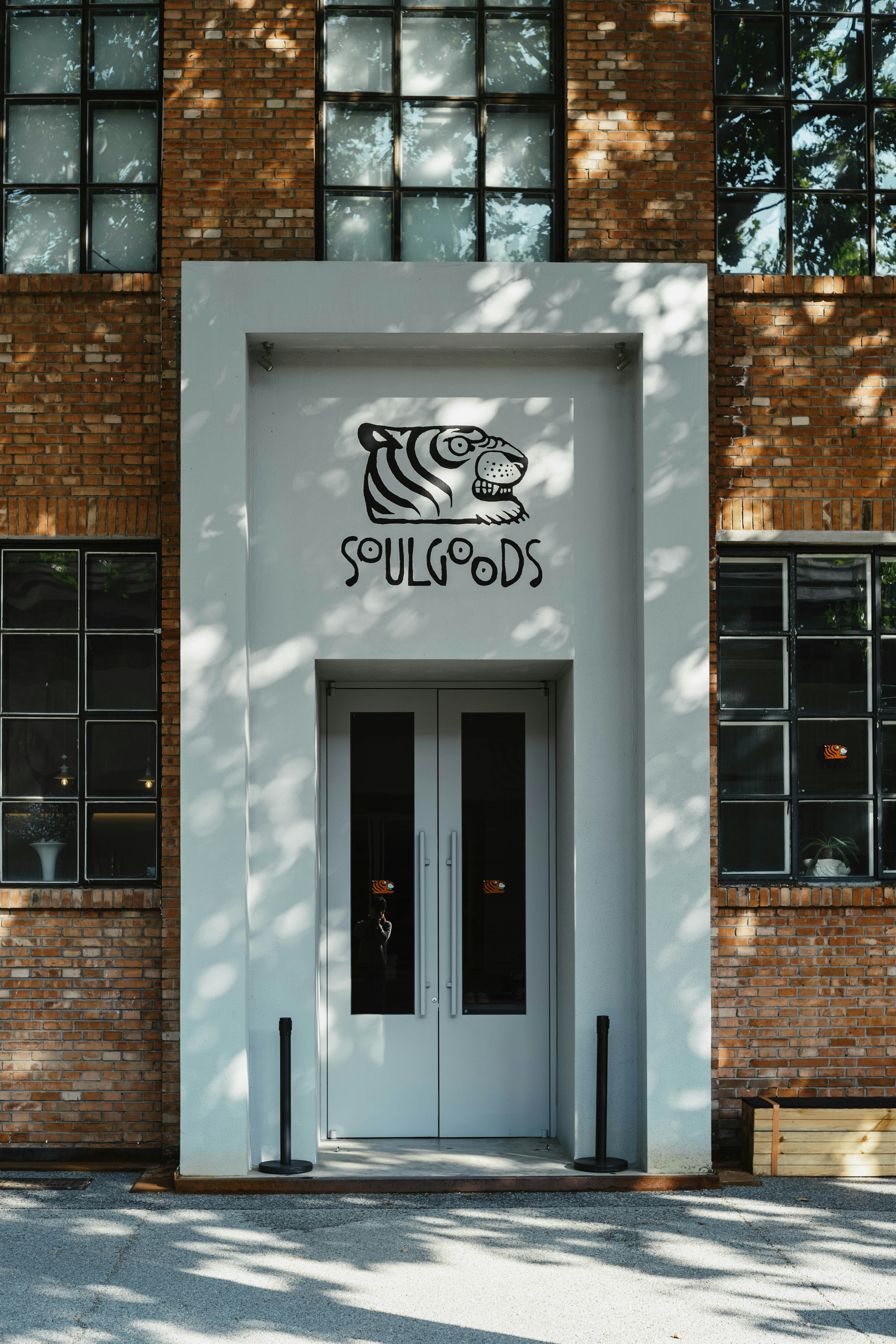 Modern building entrance with sleek metal architectural signage